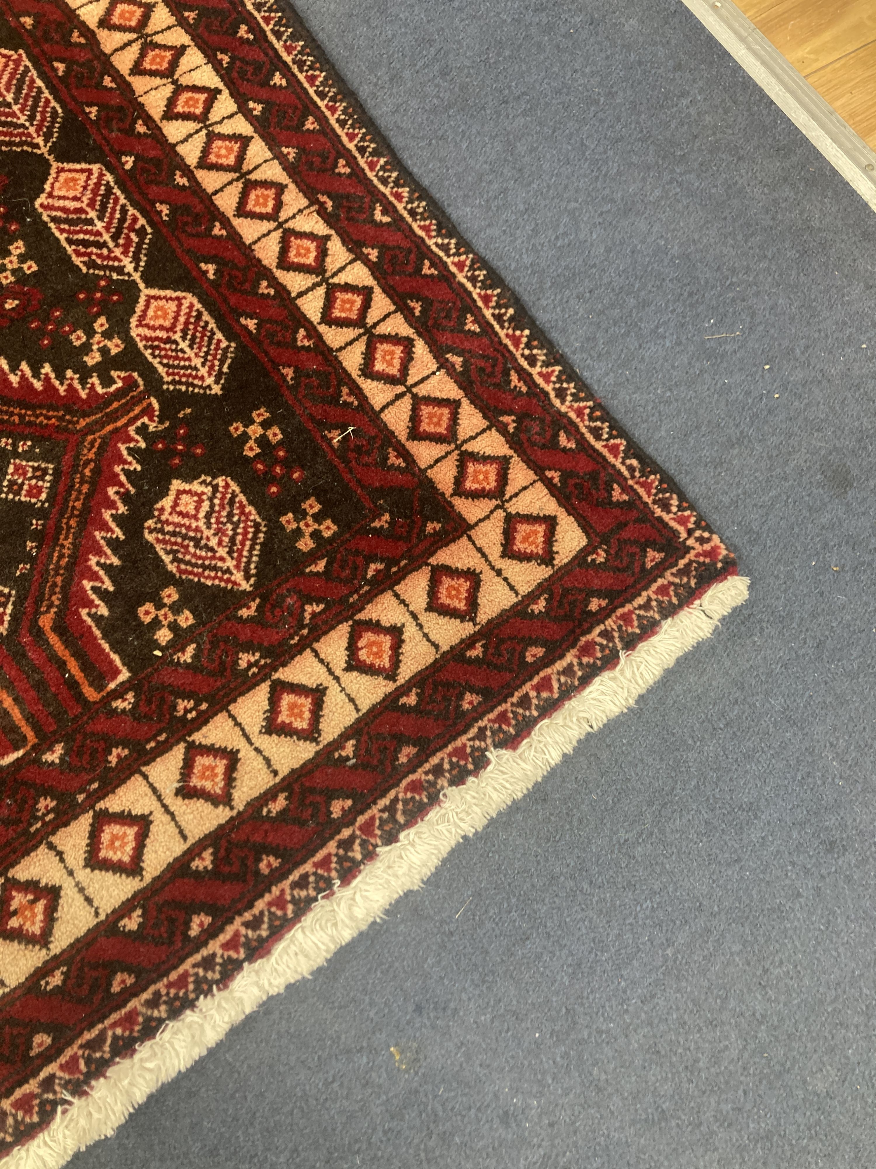 A Bakhtiari red ground rug, 210 x 110cm 210 x 110cm